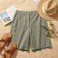 Linara Linen Bermuda Shorts - Sage Green flat lay accessories